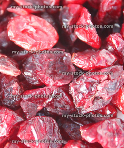 Stock image showing pile of dried cranberries / red cranberry fruit healthy snacks, bladder infections