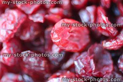 Stock image showing pile of dried cranberries / red cranberry fruit healthy snacks, antioxidants