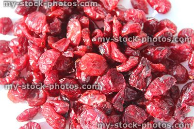 Stock image showing pile of dried cranberries / red cranberry fruit healthy snacks, vitamins