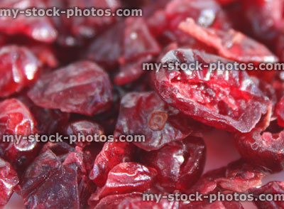 Stock image showing pile of dried cranberries / red cranberry fruit healthy snack food