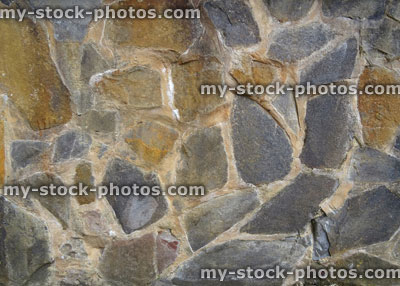 Stock image of irregular stone wall, grey rocks / sandstone, crazy paving