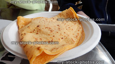 Stock image of freshly cooked crepe from fastfood takeaway kiosk, paper plate