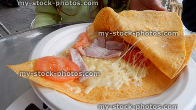 Stock image of freshly cooked crepe from fastfood takeaway kiosk, paper plate