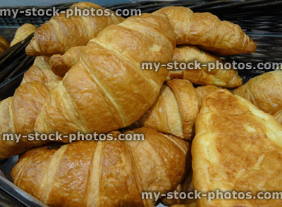 Stock image of freshly baked croissants in bakery, buttery, flaky pastry