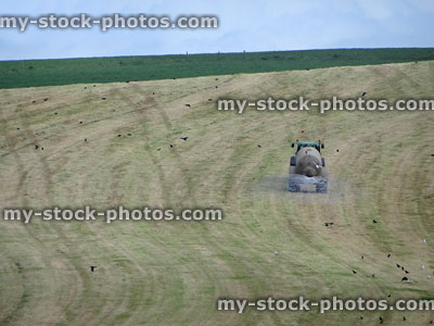 Stock image of crop spraying in farm field with tractor / chemicals