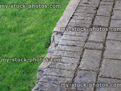 Stock image of concrete brick effect pathway, crumbling due to frost damage