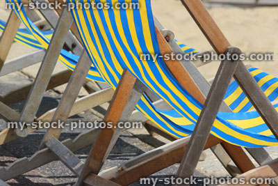 Stock image of beach deckchairs on beachfront promenade, traditional English summer holiday scene