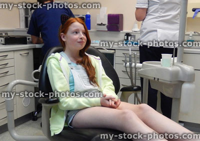 Stock image of worried girl in dentist chair, toothache, teeth, dental appointment19/8/2014
