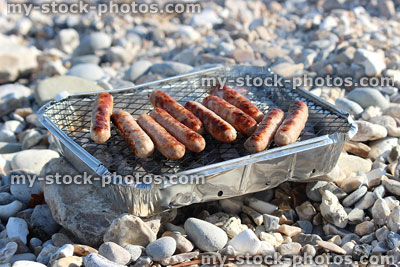Stock image of disposable aluminium barbecue, cooking food for beach picnic