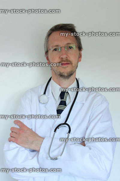 Stock image of hospital doctor, standing with folded arms and stethoscope