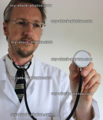 Stock image of hospital doctor's stethoscope, with blurred doctor in background