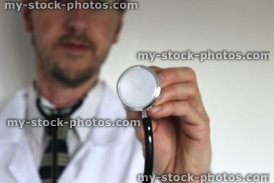 Stock image of hospital doctor's stethoscope, with blurred doctor in background