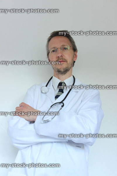 Stock image of hospital doctor, standing with folded arms and stethoscope