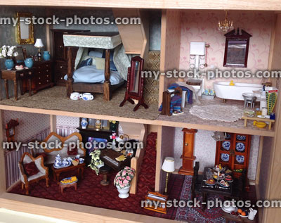 Stock image of dolls house with bedroom, bathroom and lounge