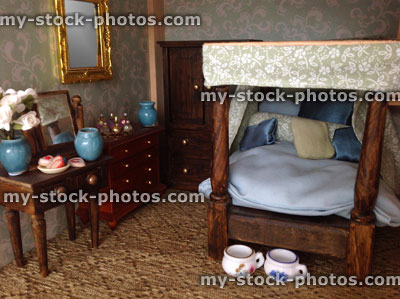 Stock image of dolls house bedroom, with four poster bed