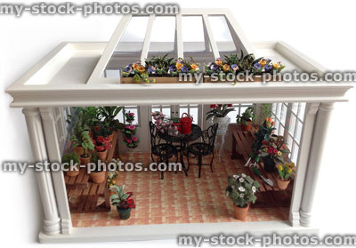 Stock image of wooden dolls house conservatory, painted white