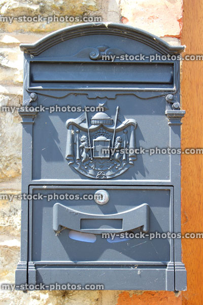 Stock image of cast aluminium post box / letterbox outside front door