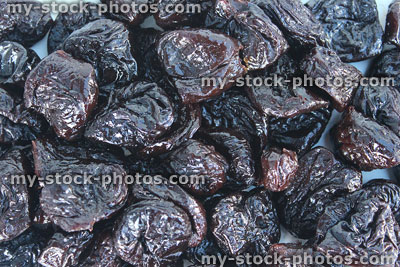Stock image of pile of dried prunes / stoned fruit, healthy food, natural laxative