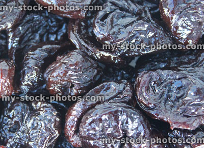 Stock image of pile of dried prunes / stoned fruit, healthy food, appetite suppressant