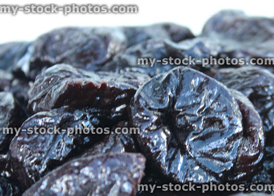 Stock image of pile of dried prunes / wrinkled stoned fruit, healthy food
