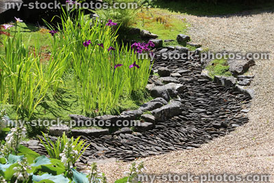 Stock image of Japanese garden dry river stream with pebbles, slate paddlestones