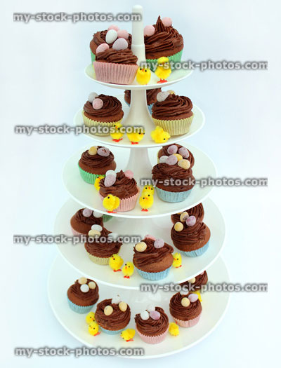 Stock image of five tier cake stand displaying Easter cakes 