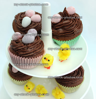 Stock image of top of tiered cake stand displaying Easter cakes