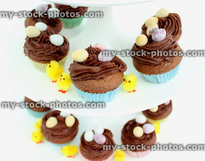 Stock image of tiered cake stand displaying Easter cakes (close up)