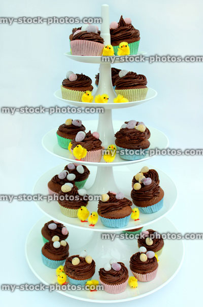 Stock image of five tier cake stand displaying Easter cakes 
