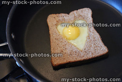 Stock image of egg in hole toast / heart shaped fried egg