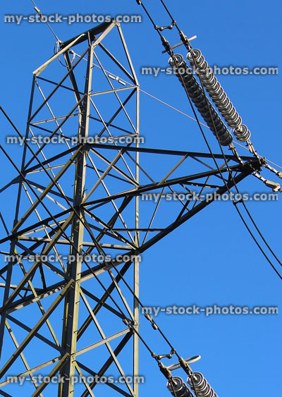 Stock image of metal electricity pylon / transmission tower, cage, wires, insulators