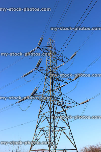 Stock image of double circuit electricity pylon / transmission tower, cage, wires, insulators, blue sky