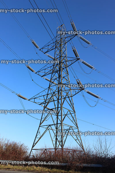 Stock image of steel electricity pylon / transmission tower, cage, wires, insulators