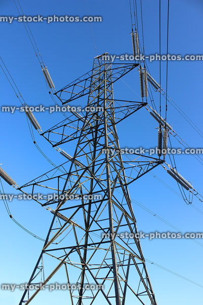 Stock image of electricity pylon / transmission tower, cage, wires, insulators, looking up, whole tower