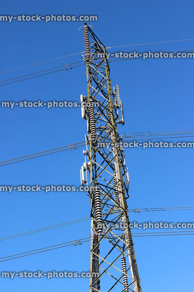 Stock image of electricity pylon / transmission tower, cage, wires, insulators, top section