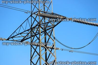 Stock image of electricity pylon / transmission tower, cage, wires, insulators, blue sky, crossarms
