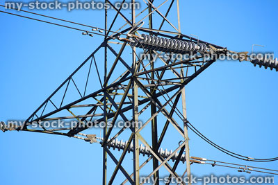 Stock image of high voltage electricity pylon / transmission tower, cage, wires, insulators