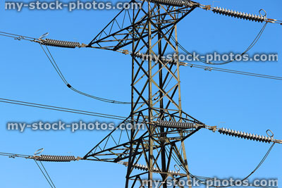 Stock image of electricity pylon / transmission tower, cage, wires, insulators, close up