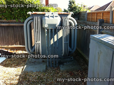 Stock image of small electricity substation transformer on housing estate / powering houses