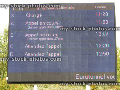Stock image of digital Eurotunnel timetable sign / signpost with train times