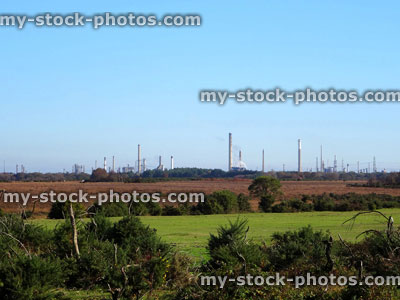 Stock image of industrial factory chimneys with smoke causing pollution, emitting carbon dioxide