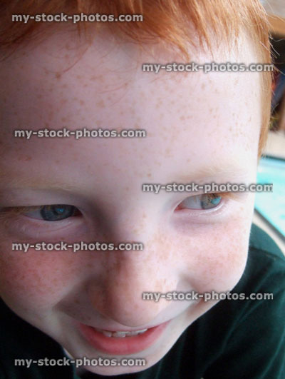 Stock image of boy's face laughing (candid close up)