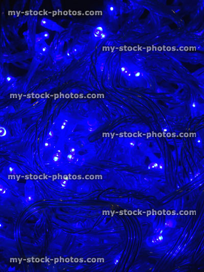Stock image of tangled blue Christmas tree fairy lights, twinkling xmas LED lights