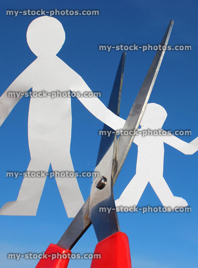 Stock image of paperchain father and son separation / cut with scissors (family divorce)