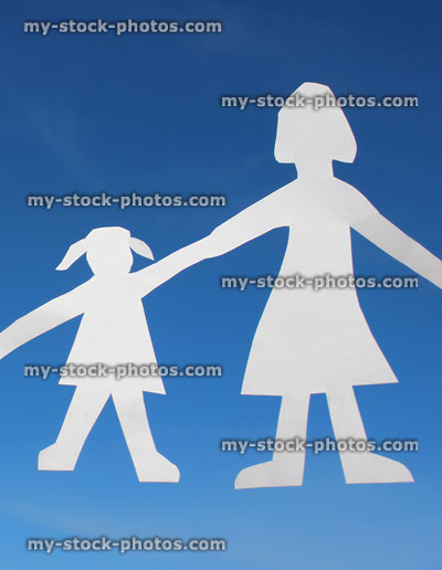 Stock image of mother and daughter cutouts, people paperchains, white paper