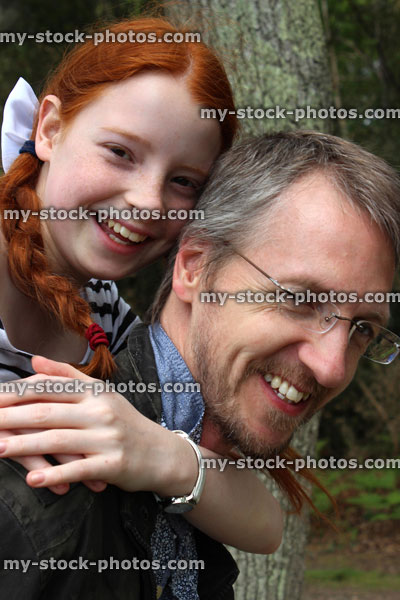 Stock image of happy father and daughter having fun piggy back