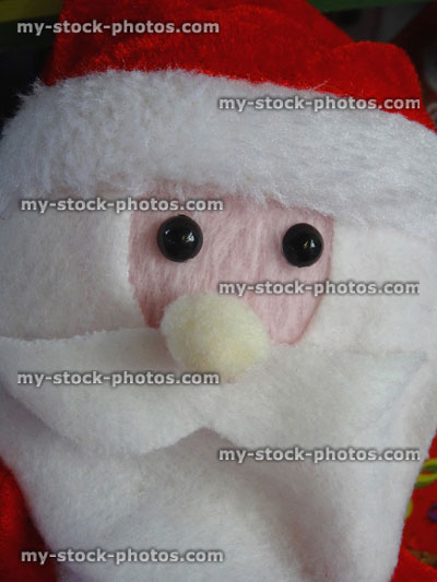 Stock image of cuddly toy cartoon Santa Claus / Father Christmas, white foam beard