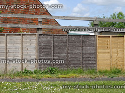 Stock image of different colour fence panels, aged / weathered wooden fencing