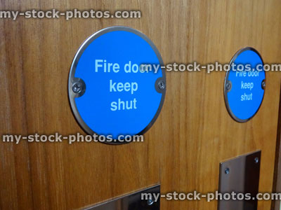 Stock image of circular blue Fire Door Keep Shut safety sign