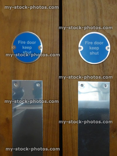 Stock image of blue circular safety 'Fire door keep shut signs'